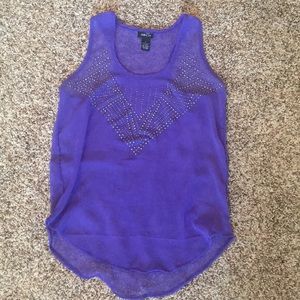 A purple, sequined tank top